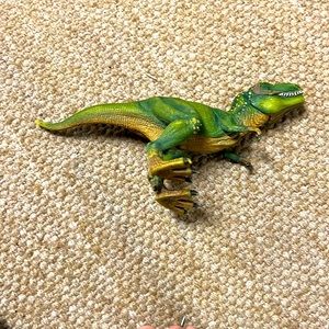 Cute little green dinosaur